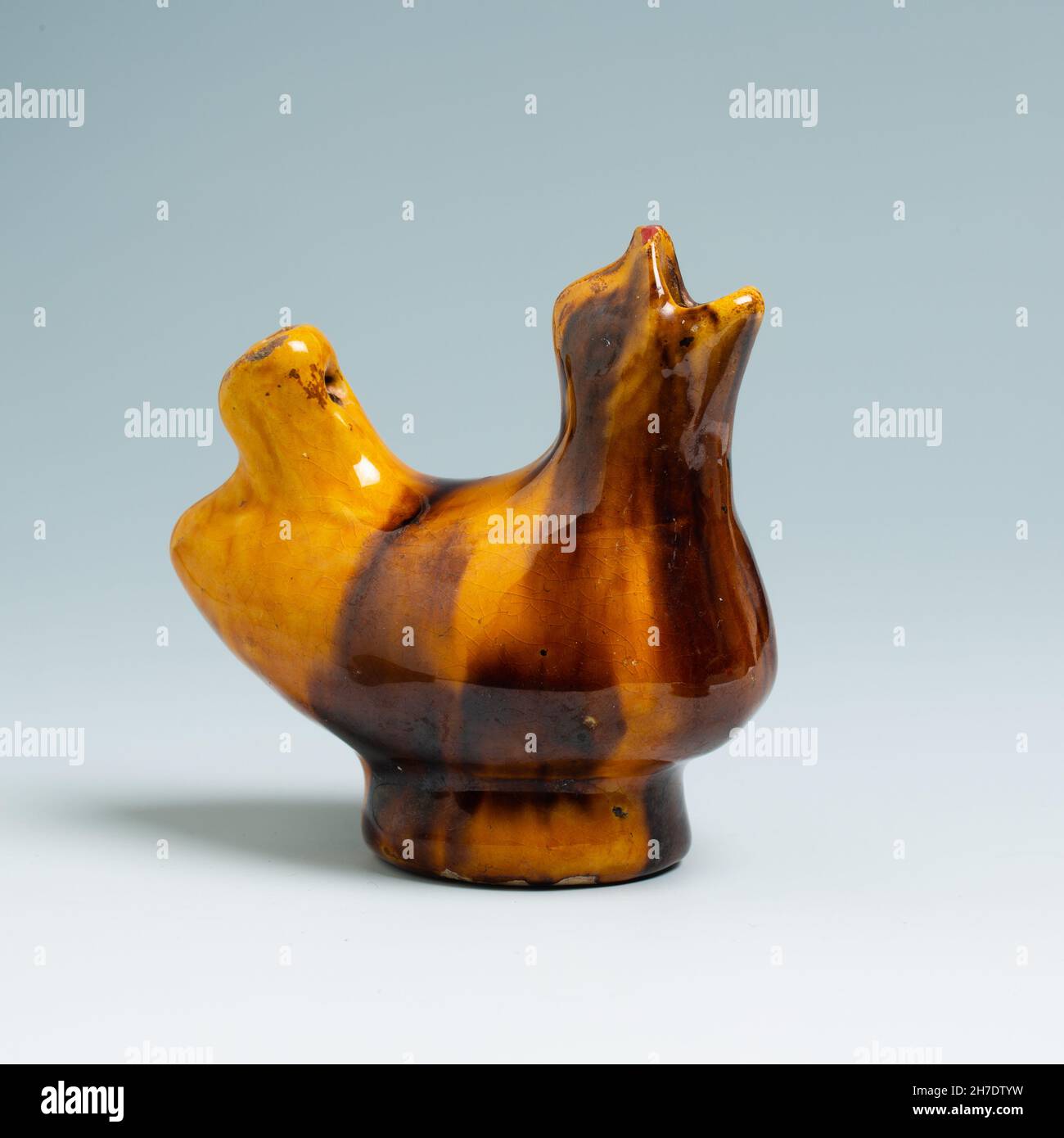 Folk-art bird whistle with treacle glaze.  Eastern European. Stock Photo