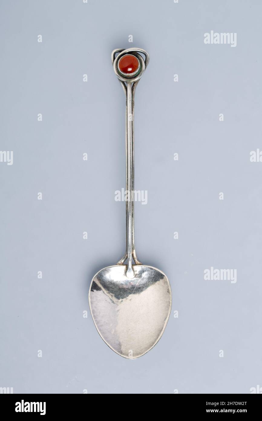 A silver spoon in the Arts and Crafts stye, circa 1920s. No makers mark. Stock Photo