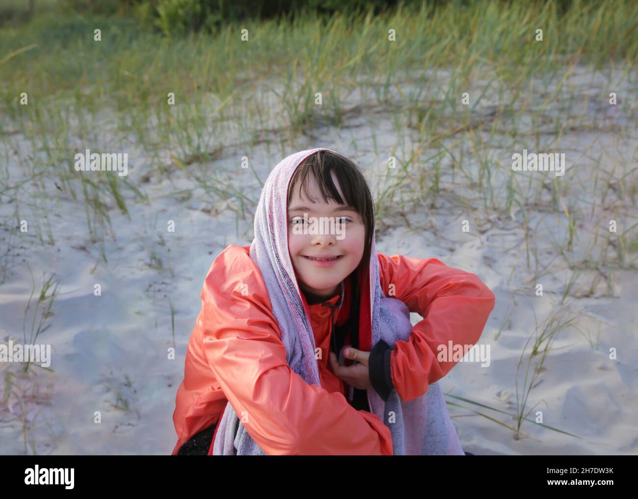 Portrait of little girl smiling outside Stock Photo - Alamy