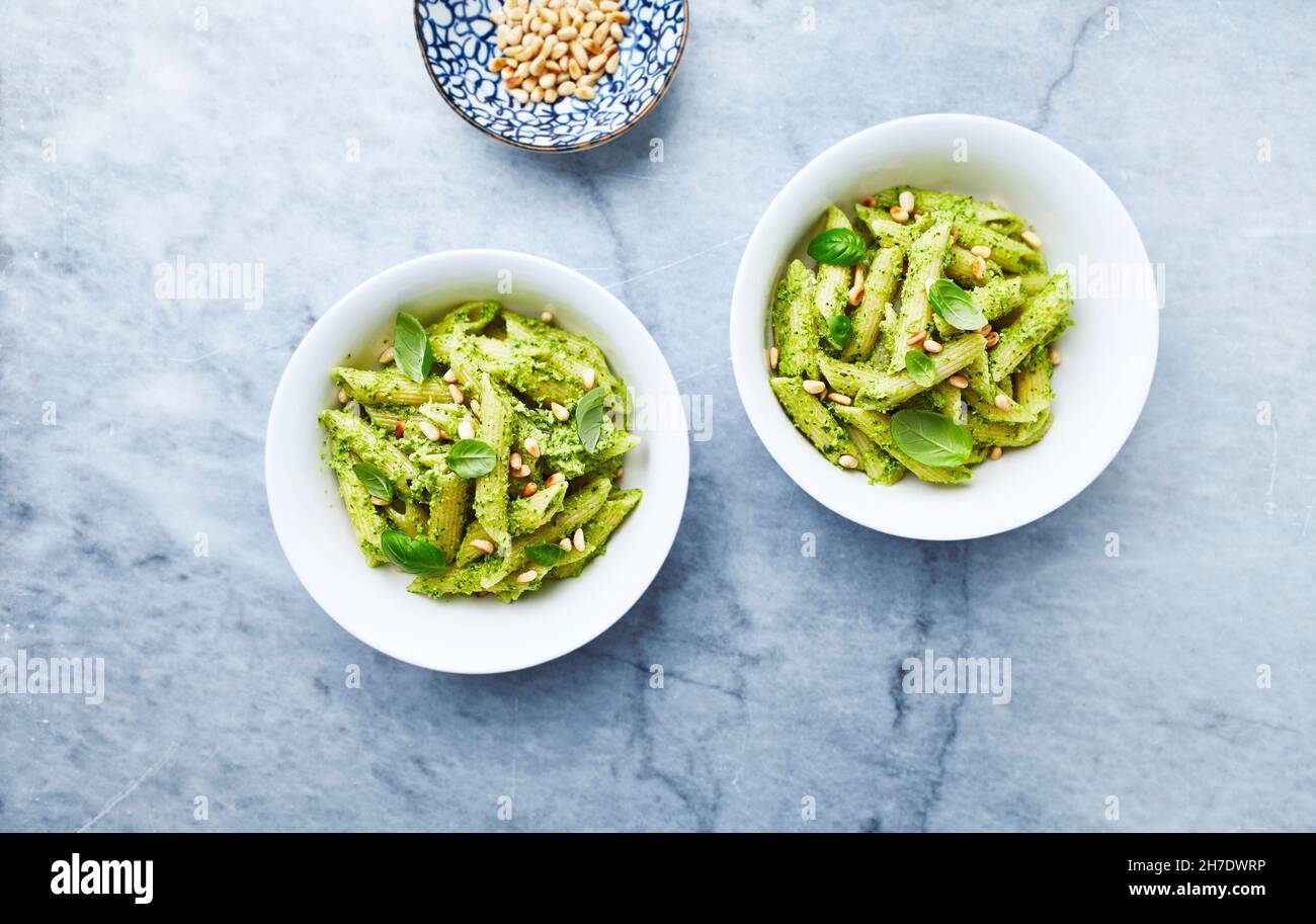 Penne pasta with kale and cashew nut pesto and toasted pine nuts Stock