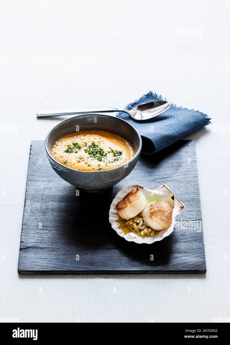 Foamy tomato and fennel soup with chives and fried scallops with fennel