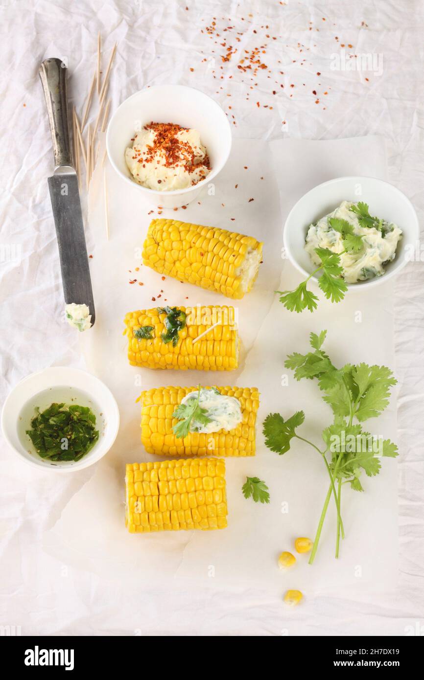 Corn cobs with dips Stock Photo - Alamy