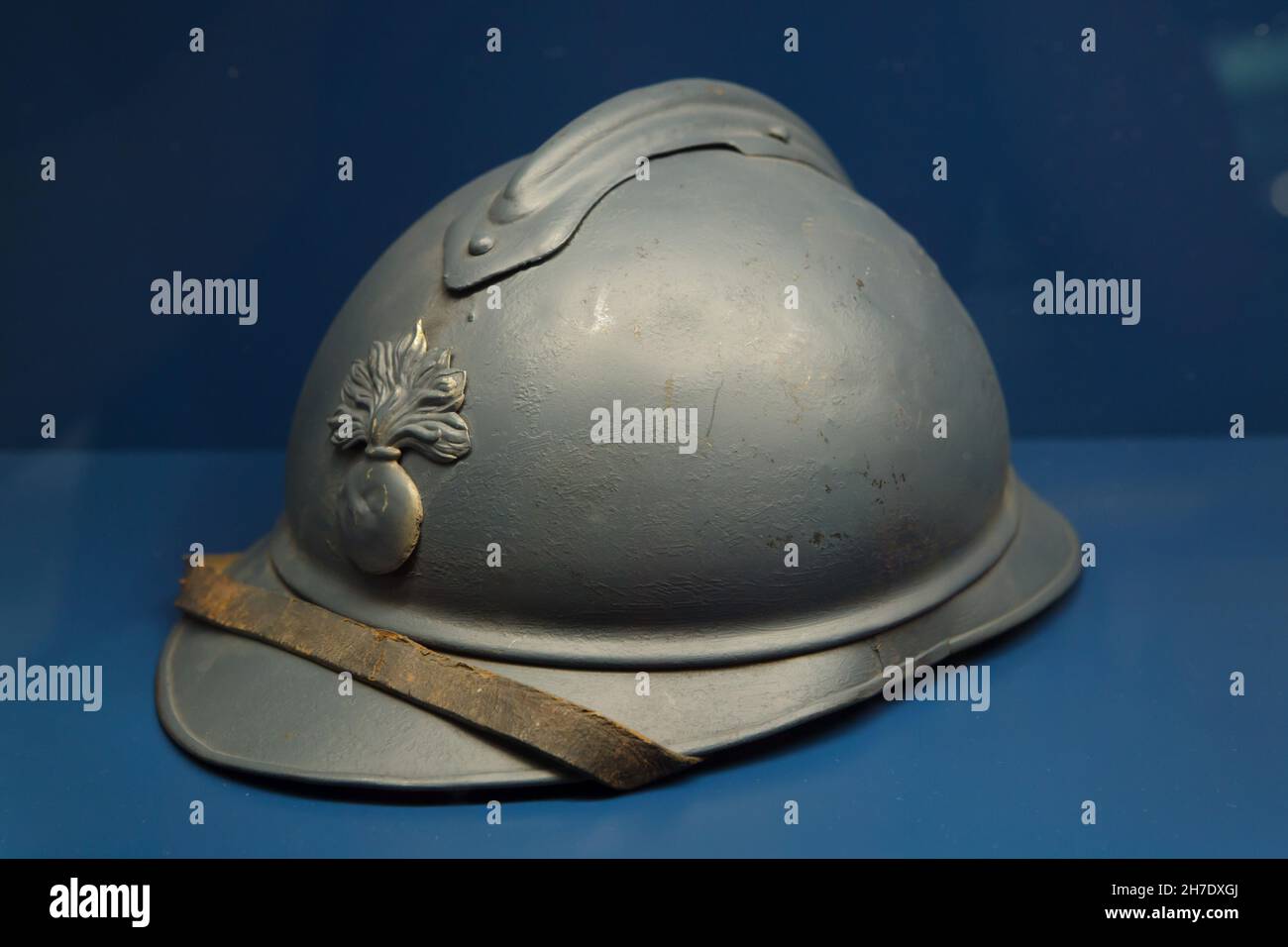 French military helmet known as the Adrian helmet (Casque Adrian) on display in the Armistice Museum in the Forest of Compiègne (Forêt de Compiègne) near Compiègne in France. The Armistice Museum is located on the ground of the Glade of the Armistice where the Armistice of 11 November 1918 that ended the First World War was signed. Stock Photo