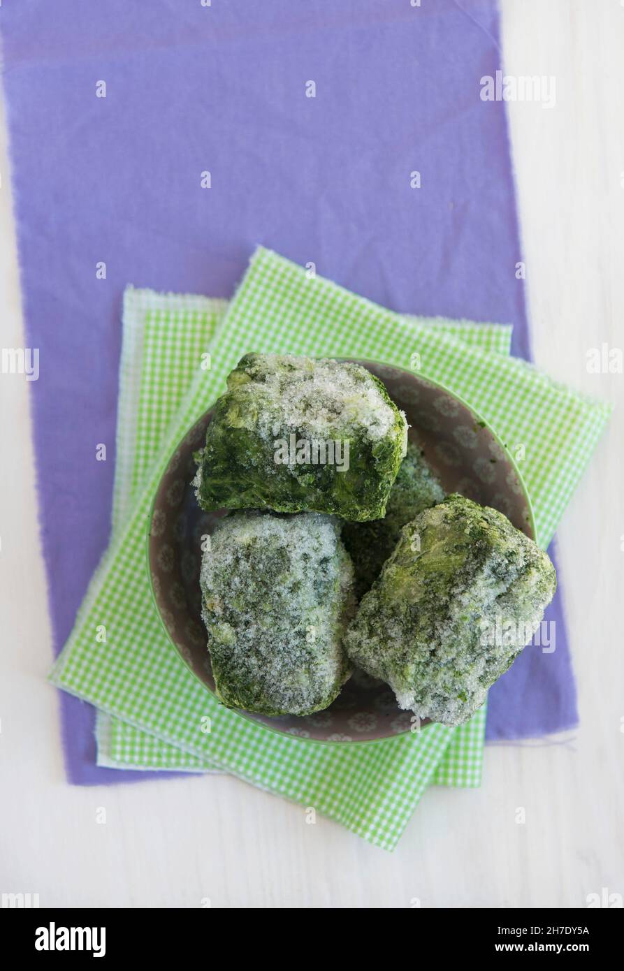 Frozen spinach portions Stock Photo - Alamy