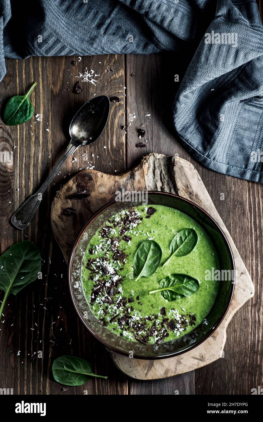 Spinach smoothie with coconut milk, chocolate and coconut shrims Stock
