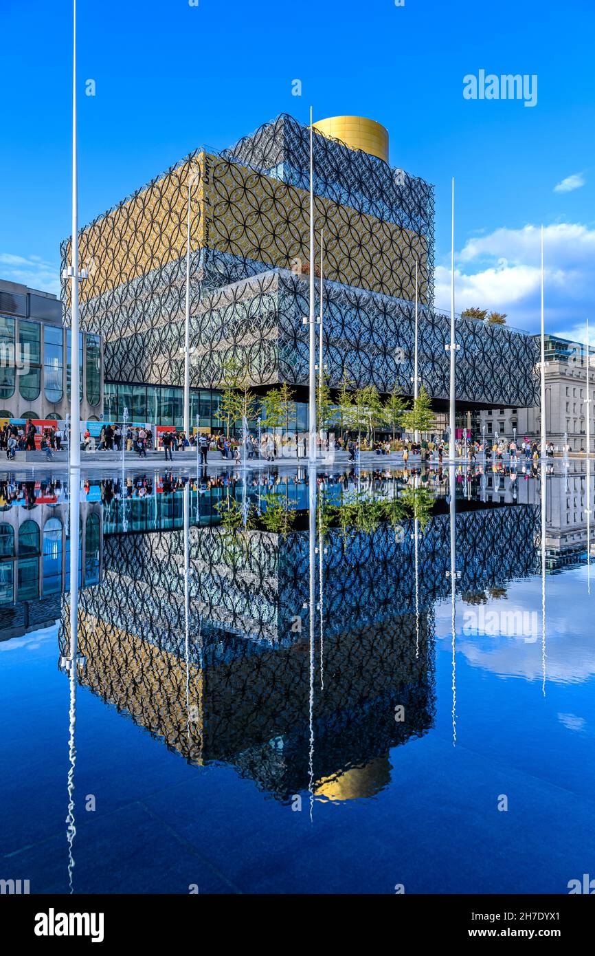 The Library of Birmingham by architects Mecanno. Completed in 2013, the largest library in UK. A shallow lake outside creates wonderful reflections. Stock Photo