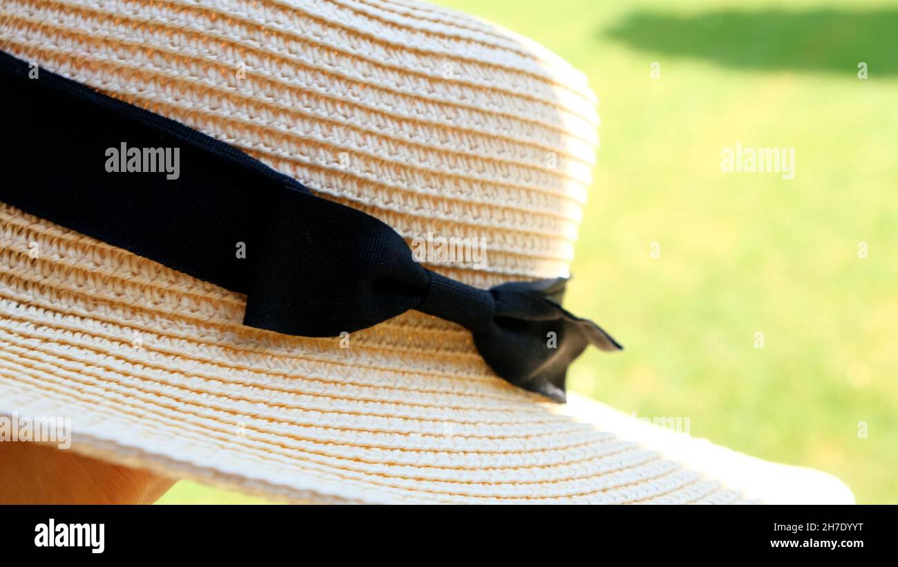 female straw hat against the backdrop of a beautiful blue sky and ...
