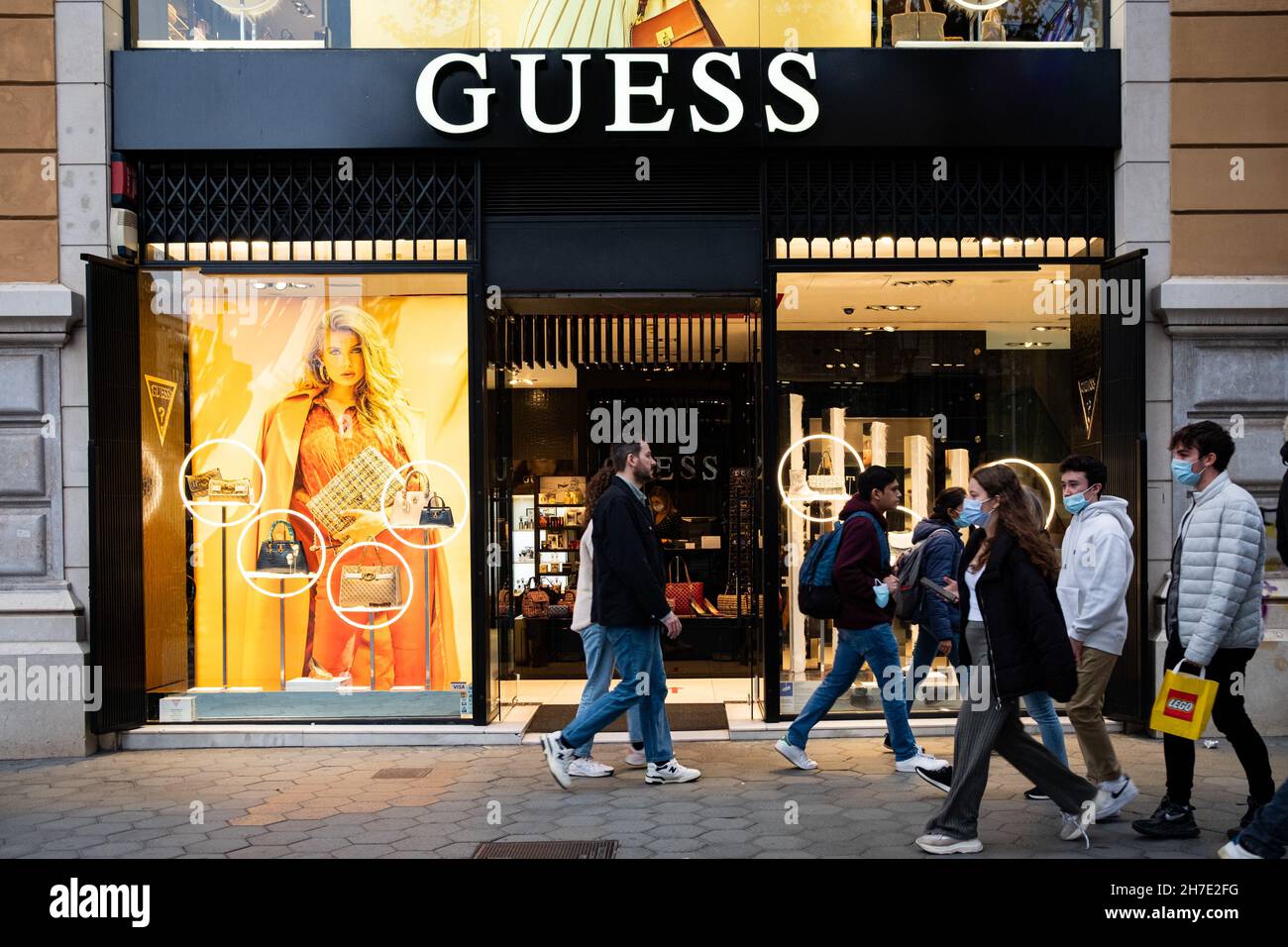 People walk past a Guess fashion store in the Passeig de Gracia street in  uptown Barcelona, Spain on November 20, 2021. (Photo by Davide Bonaldo/Sipa  USA Stock Photo - Alamy