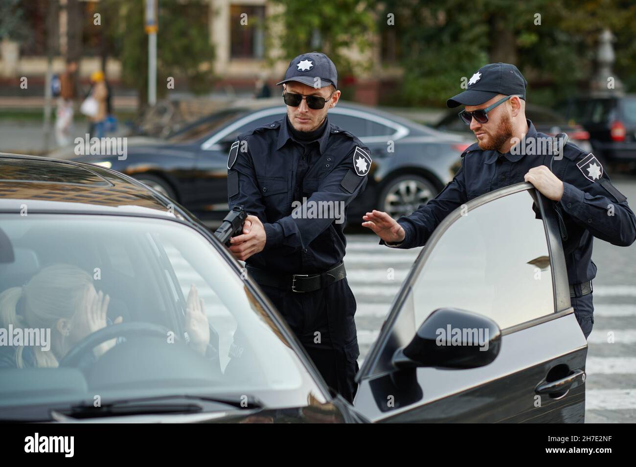 Police patrol with gun arrests female driver Stock Photo - Alamy