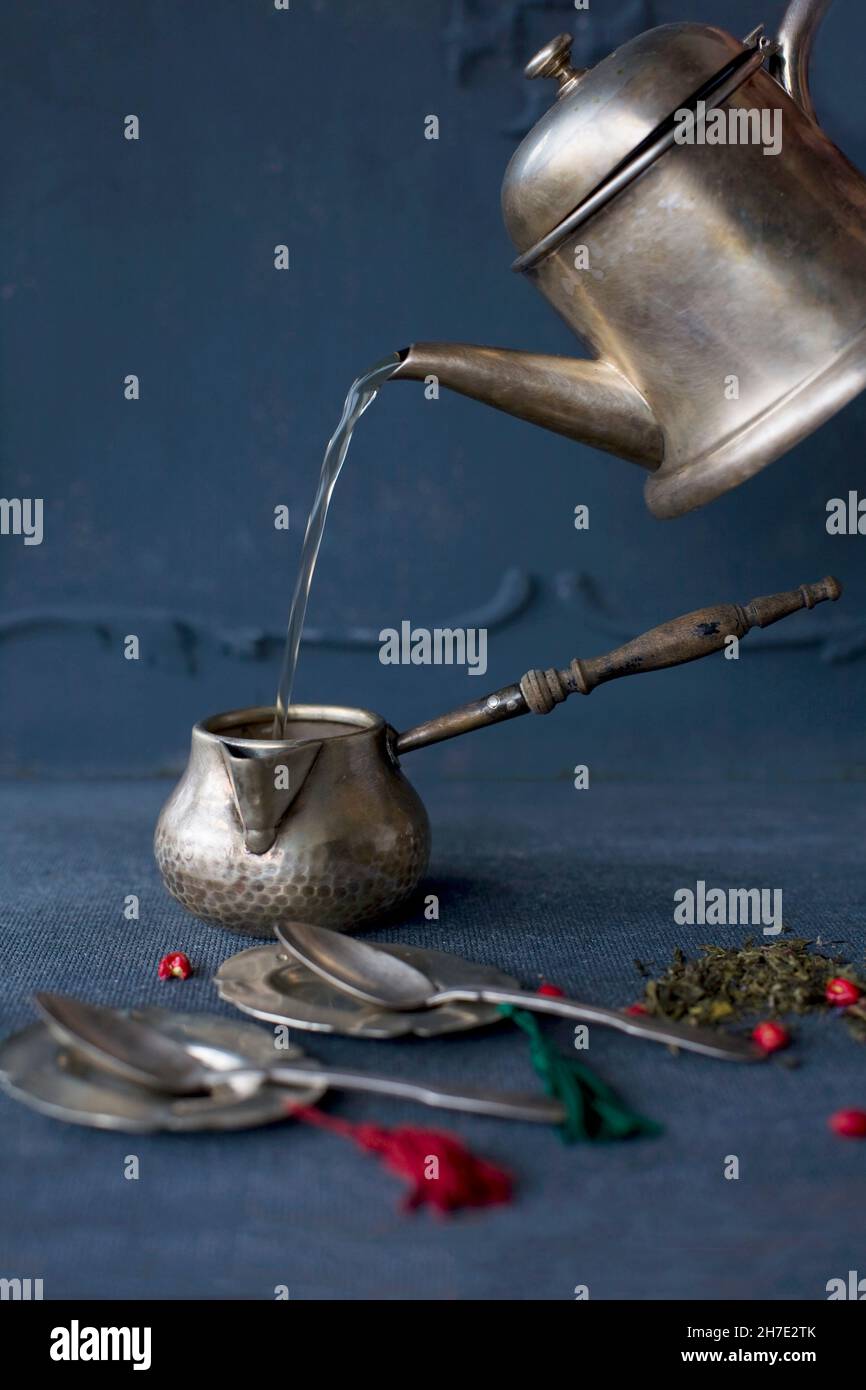 Tea making in silver jug Stock Photo Alamy