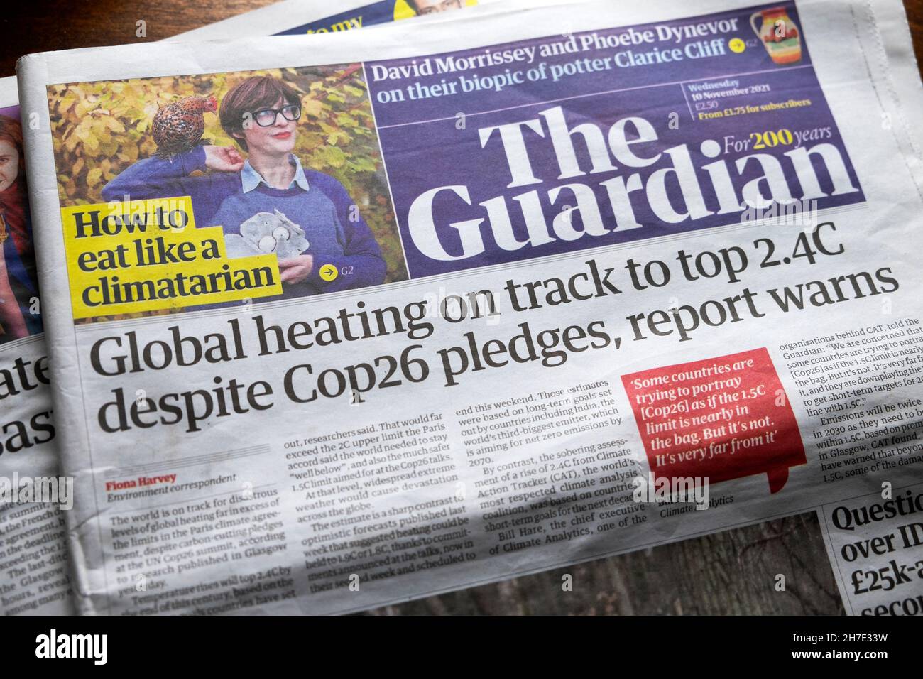 Guardian climate crisis newspaper headline 'Global heating on track to top 2.4C despite Cop26 pledges, report warnsl' 10 November 2021 London UK Stock Photo