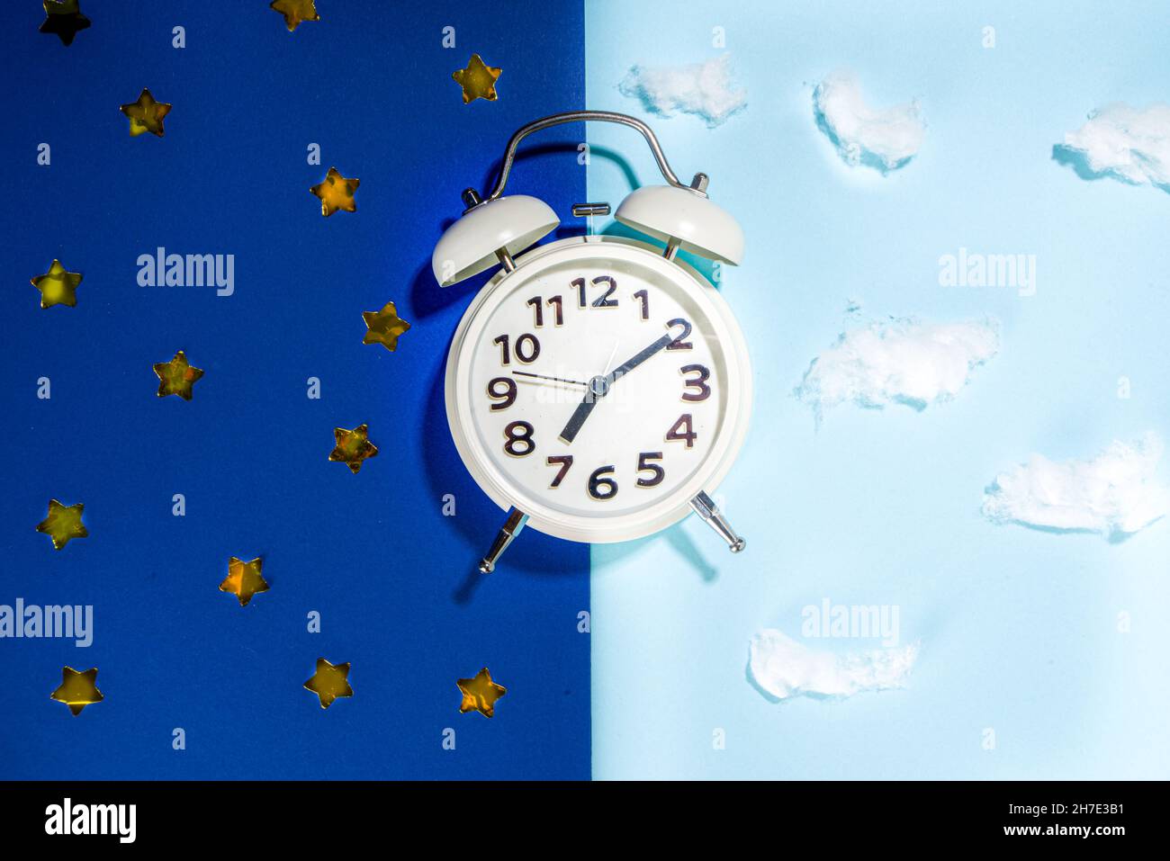 Circadian rhythms with white alarm clock, night and day backgrounds
