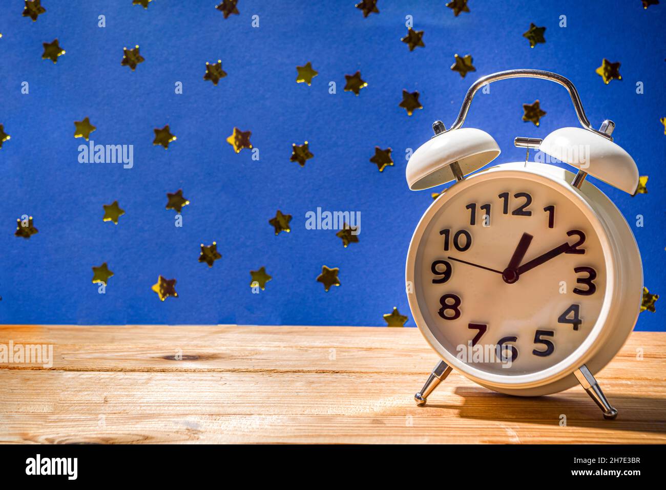 Circadian rhythms with white alarm clock, night and day backgrounds