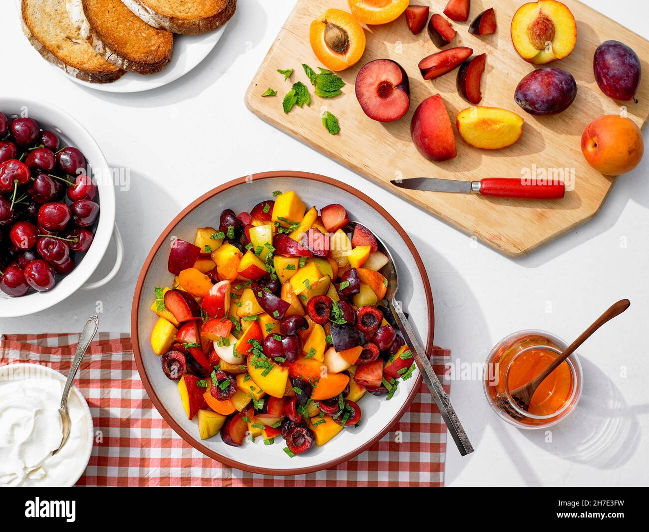 Minty Fruit Salad of Peaches, Cherries, Plums, Nectarines, Apricots and Mangoes Stock Photo