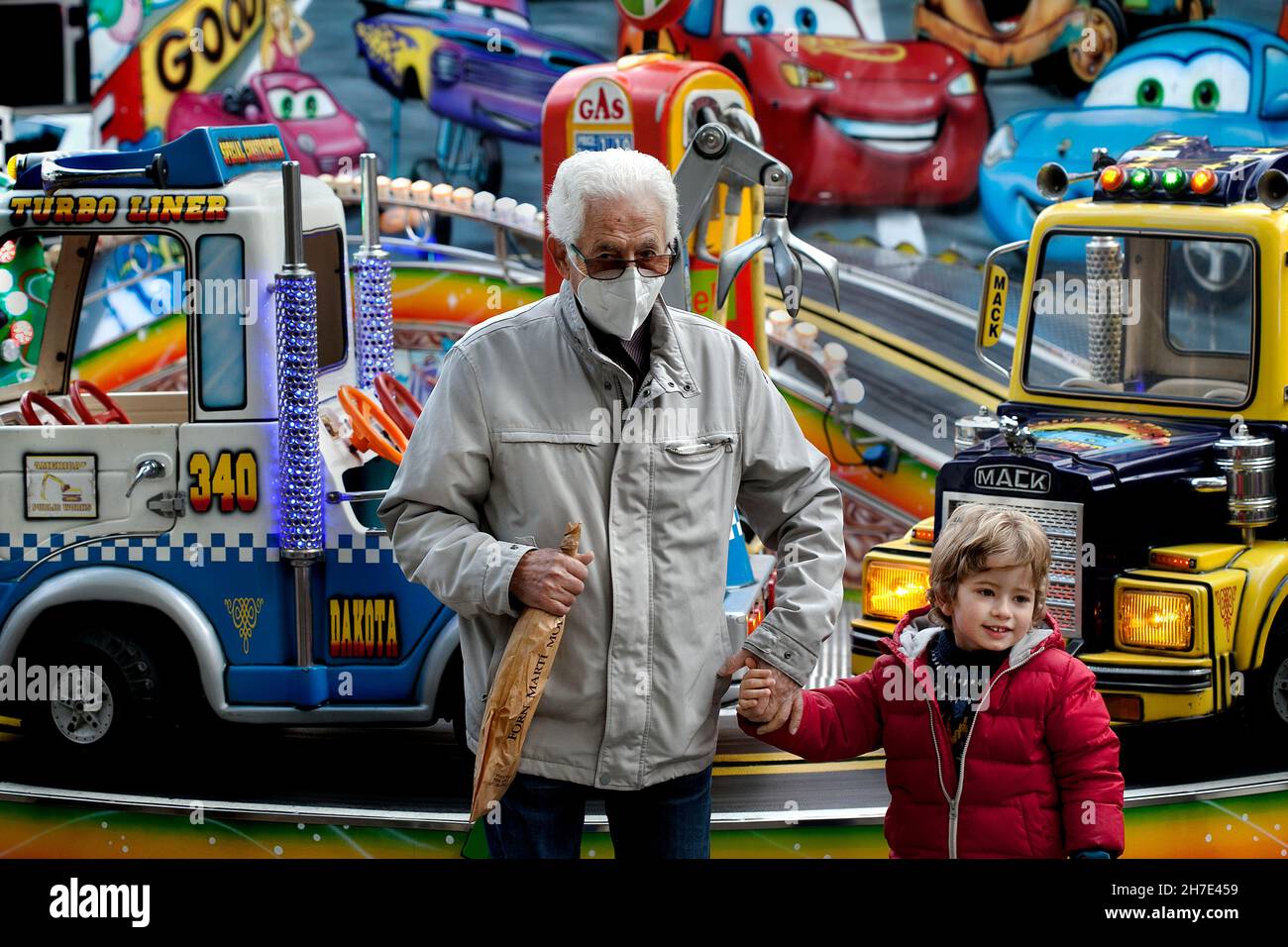 Grandfather and grandson at fair, Barcelona, Spain. Stock Photo