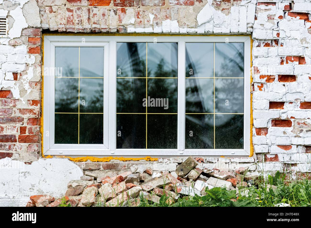 New rectangular window set in an old red brick wall. From the window of the world series. Stock Photo
