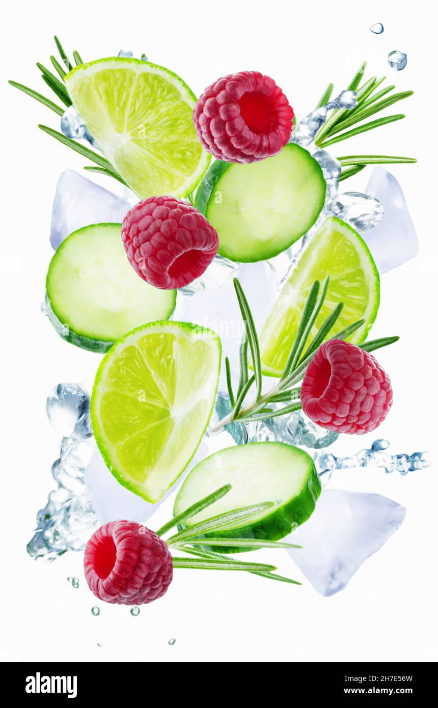 Lime, cucumber, rosemary and raspberry flying with ices and water splash Stock Photo