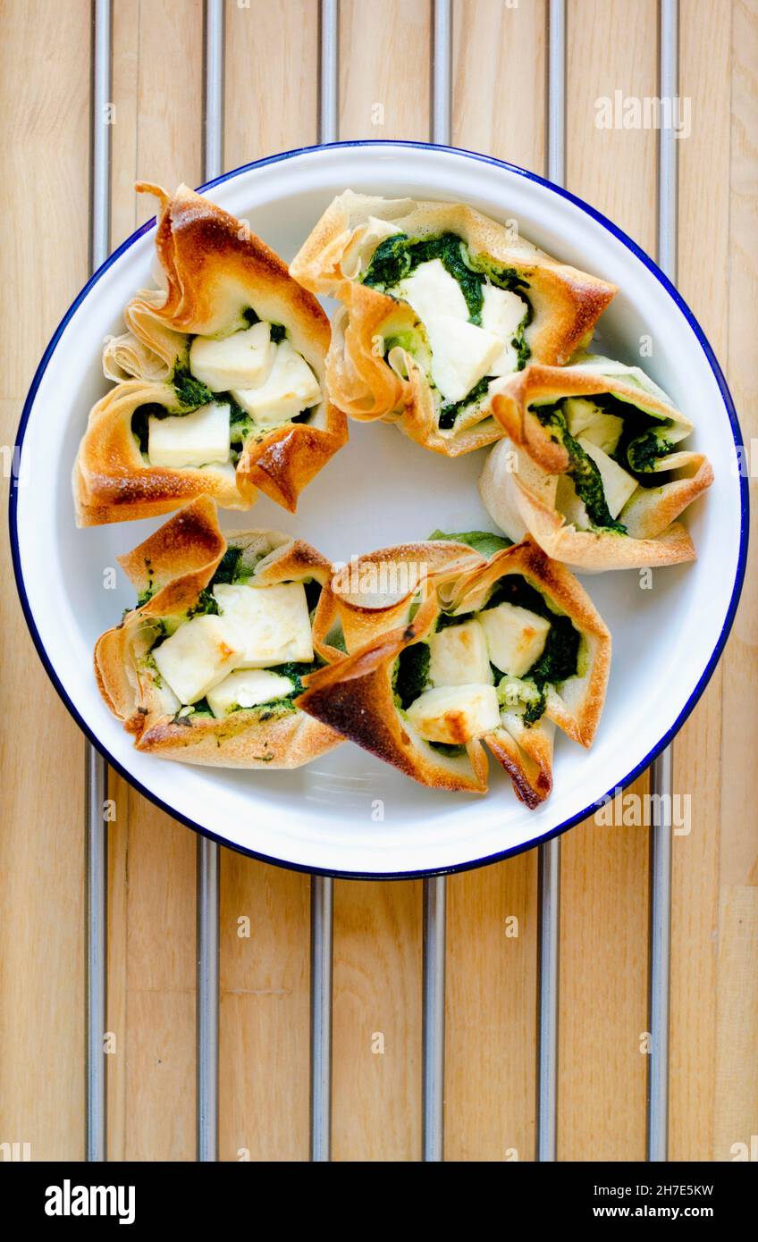 Filo pastry packets filled with feta cheese and spinach (Greece Stock