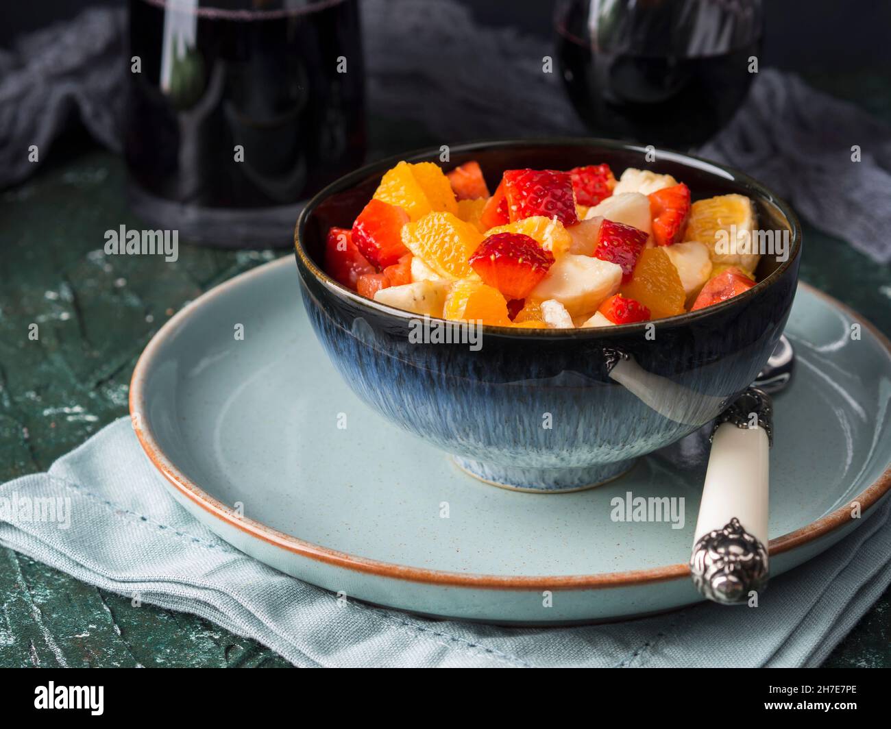 Fruit macedonia salad with strawberries, oranges and banana with lemon juice, brown sugar and orange liqueur Stock Photo