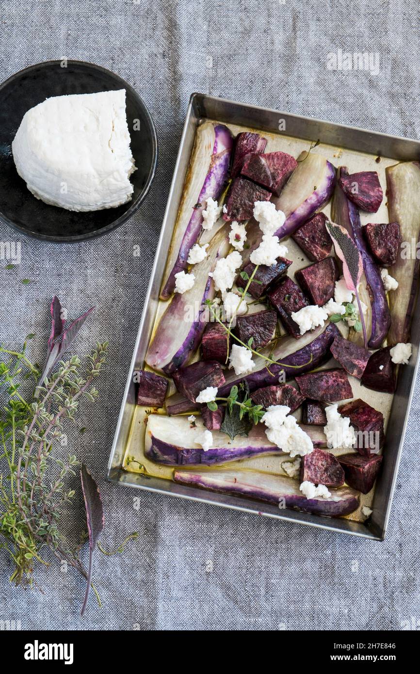 Baked potatoes and turnips violets Stock Photo Alamy