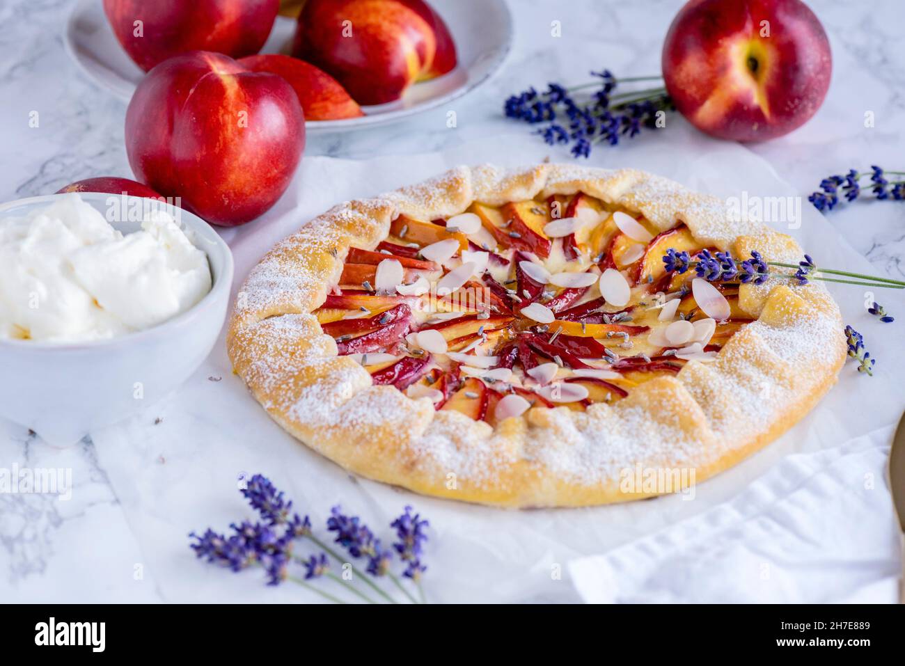 Nectarine and cream cheese galette with lavender Stock Photo