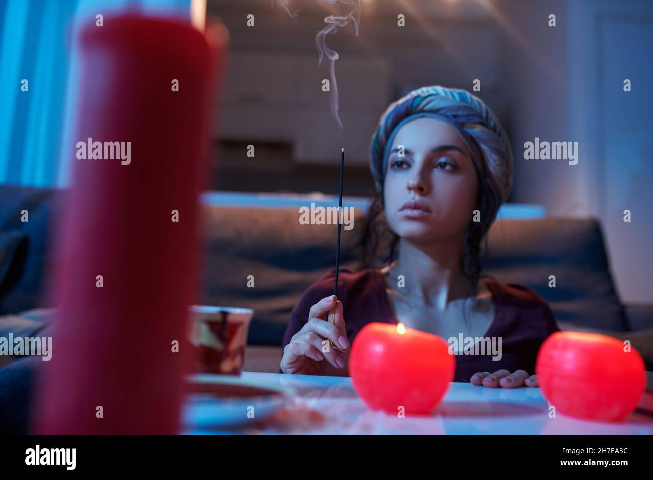 Serious Rituals Serious female soothsayer performing a magic ritual Stock Photo - Alamy