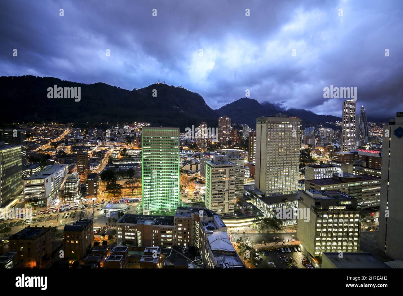 Aerial view of a cityscape with tall buildings under a cloudy sky Stock ...
