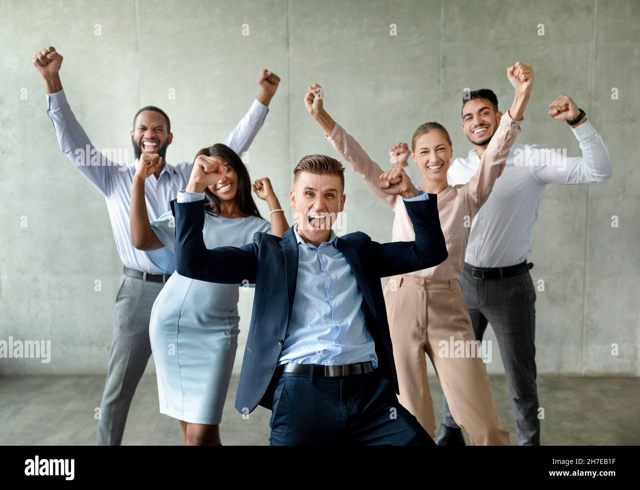 Group Of Multiethnic Business People Celebrating Success With Raised ...
