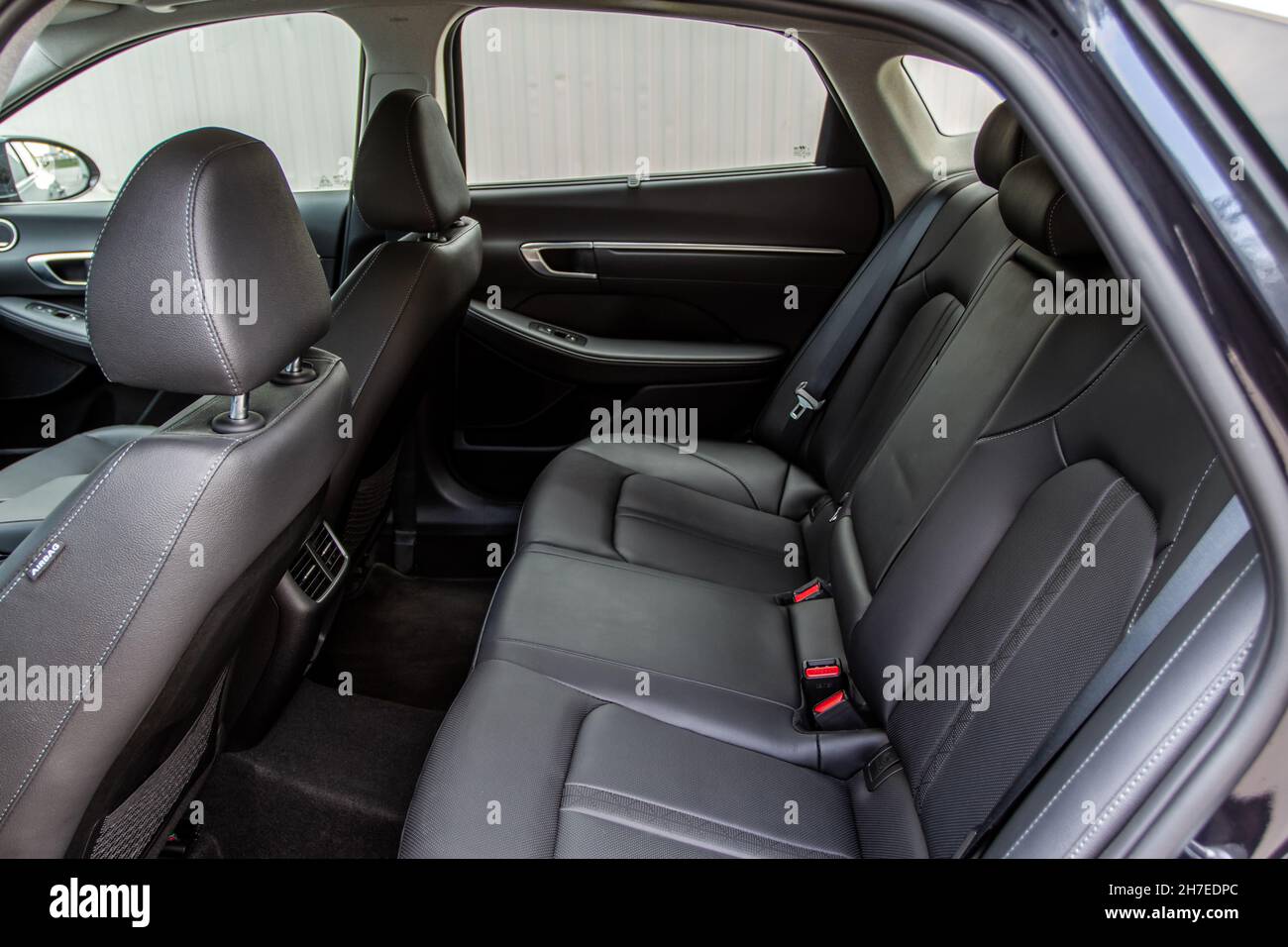 Modern sedan car inside. Leather back passenger seats in modern luxury
