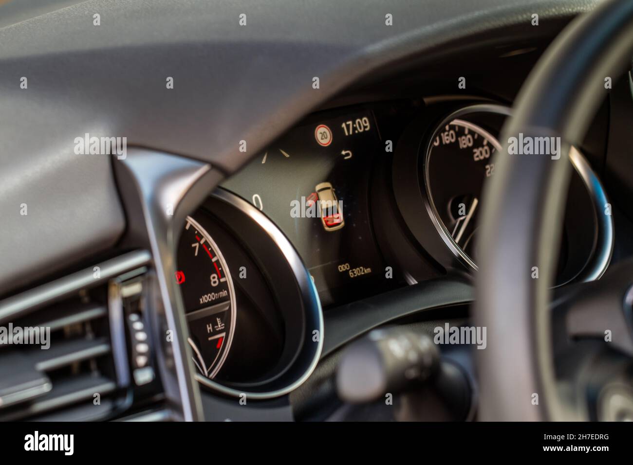 Color detail of an error message on a car dashboard. Door opened alarm. Warning light Stock
