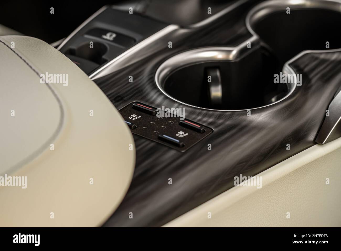 Seat heating controller buttons close up view. Car interior. Seat