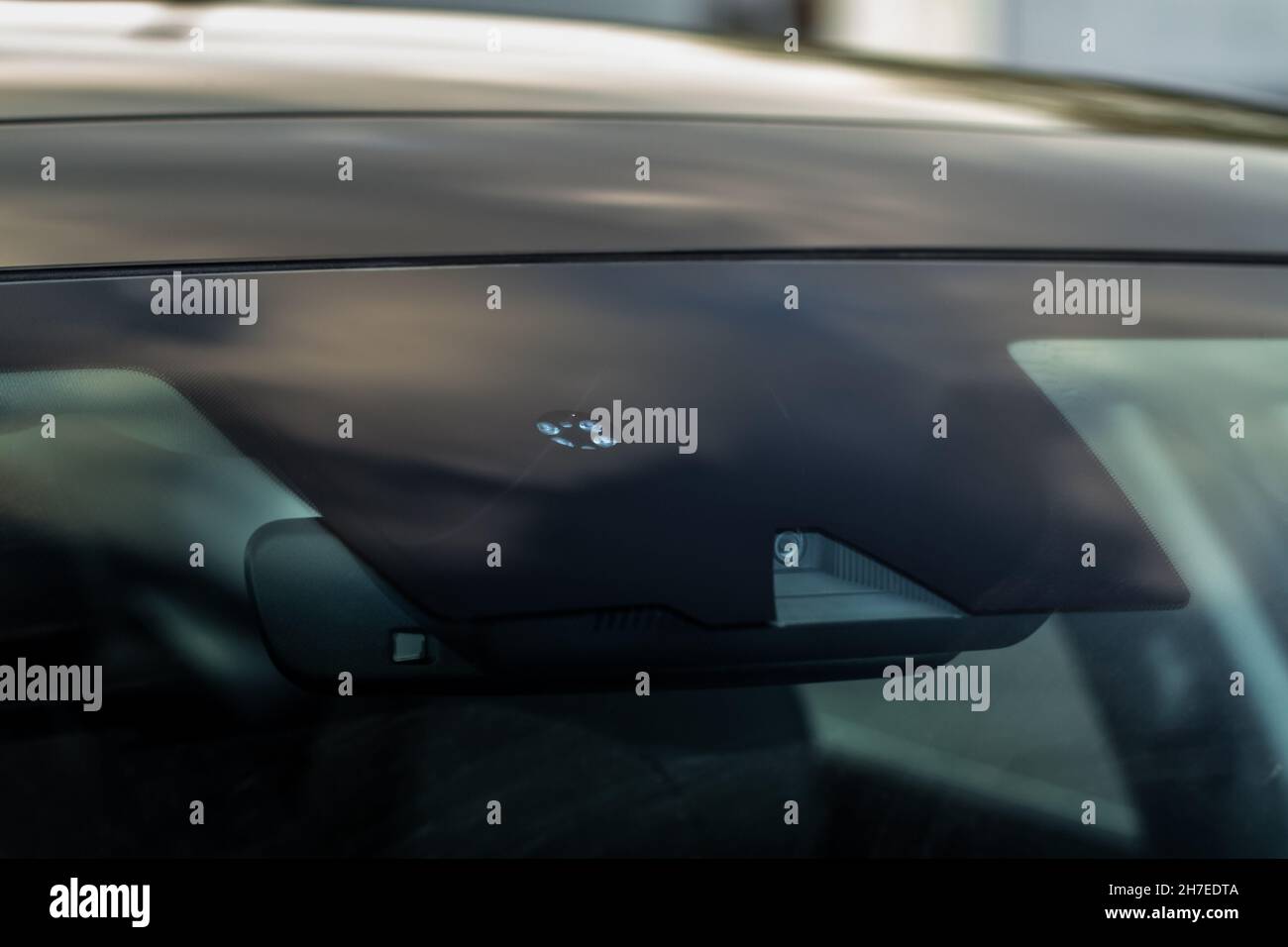 Windshield rain and light sensors of modern car. Car rain sensor Stock