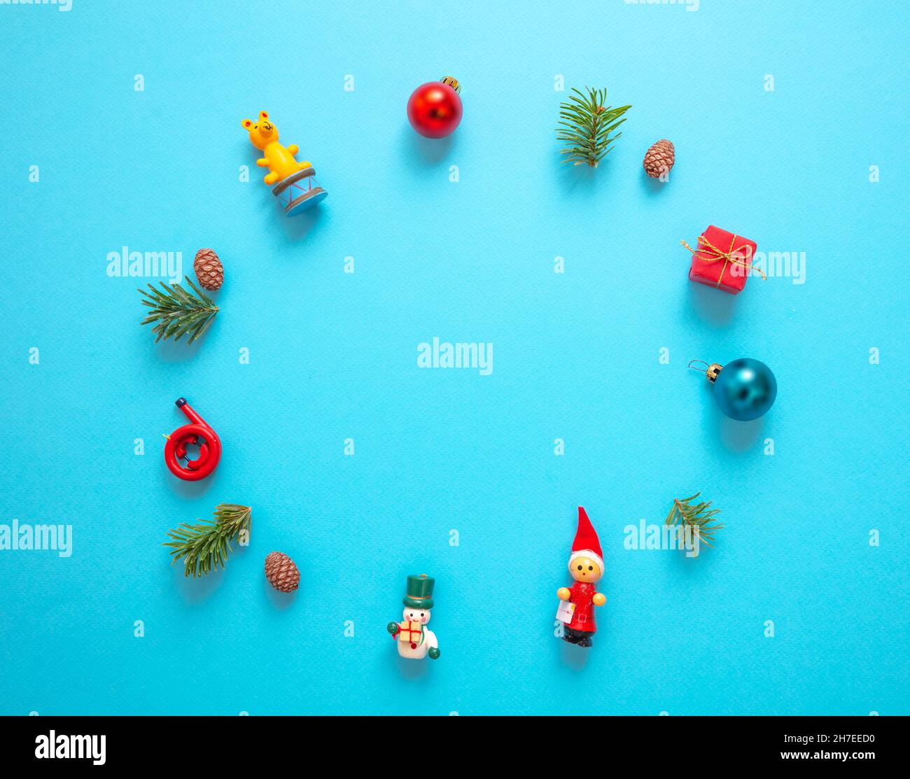 Christmas decoration wreath, baubles and ornaments on blue color ...