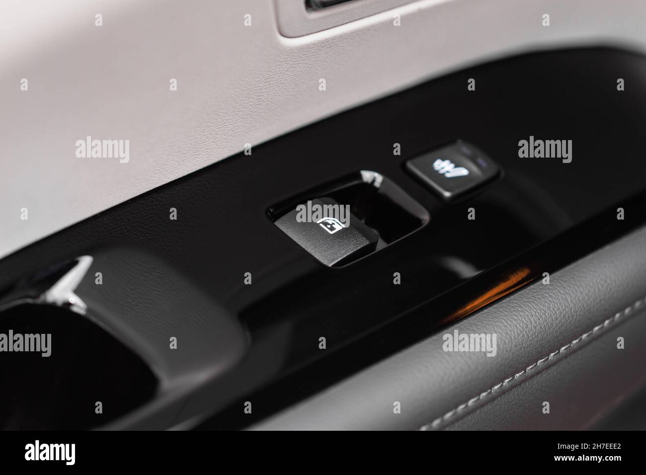 Close up view of button controlling window in modern car interior ...