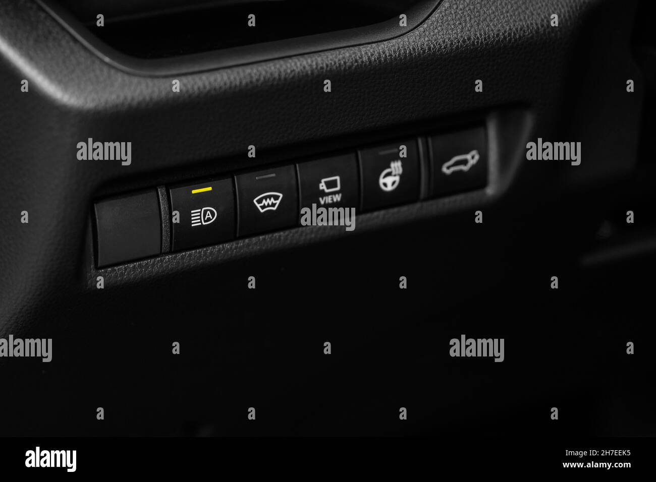 Headlight switch on of modern car. Automatic control of switching on
