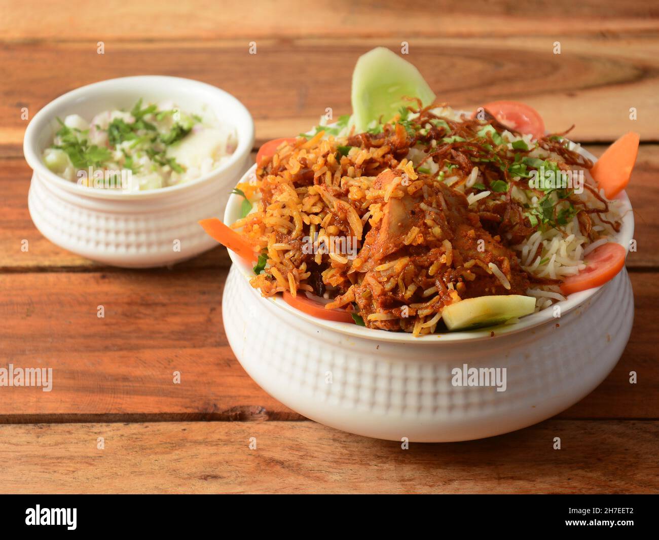 Dum Raita Traditional Hyderabadi Chicken dum Biryani made of Basmati rice cooked ...