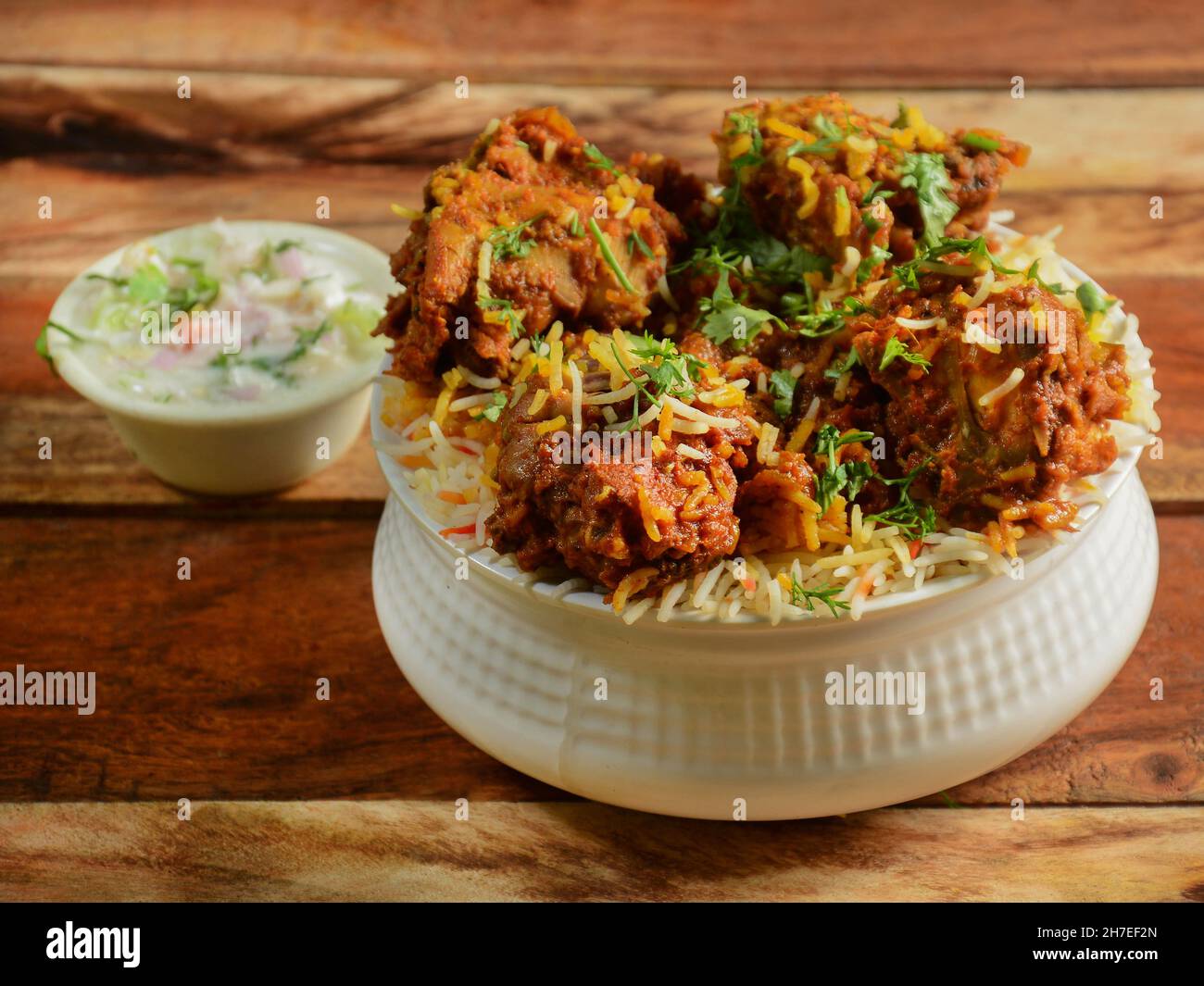 Dum Raita Traditional Hyderabadi Chicken dum Biryani made of Basmati rice cooked ...