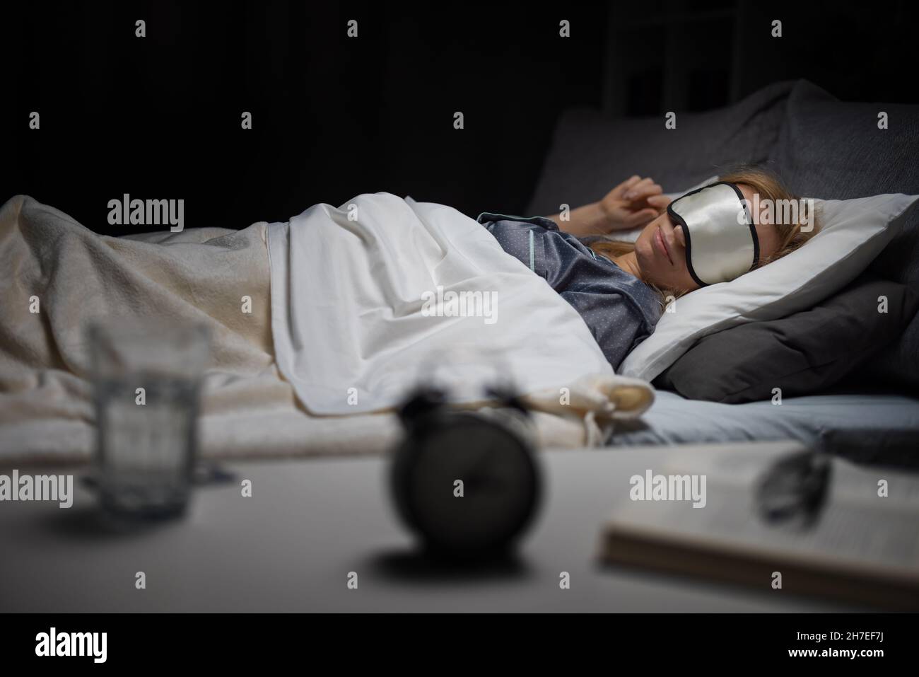 Woman having dreams at night Stock Photo - Alamy