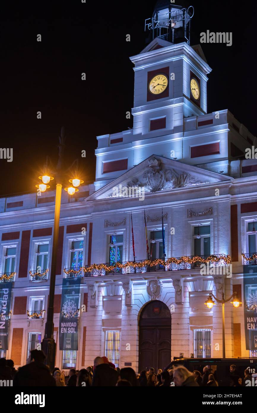 Night view of the Puerta del Sol clock with the facade illuminated at Christmas Stock Photo