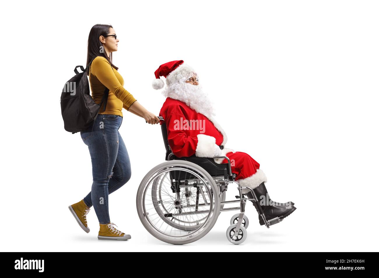 Santa Using A Walker Full length profile shot of a female tudent walking and pushing santa ...