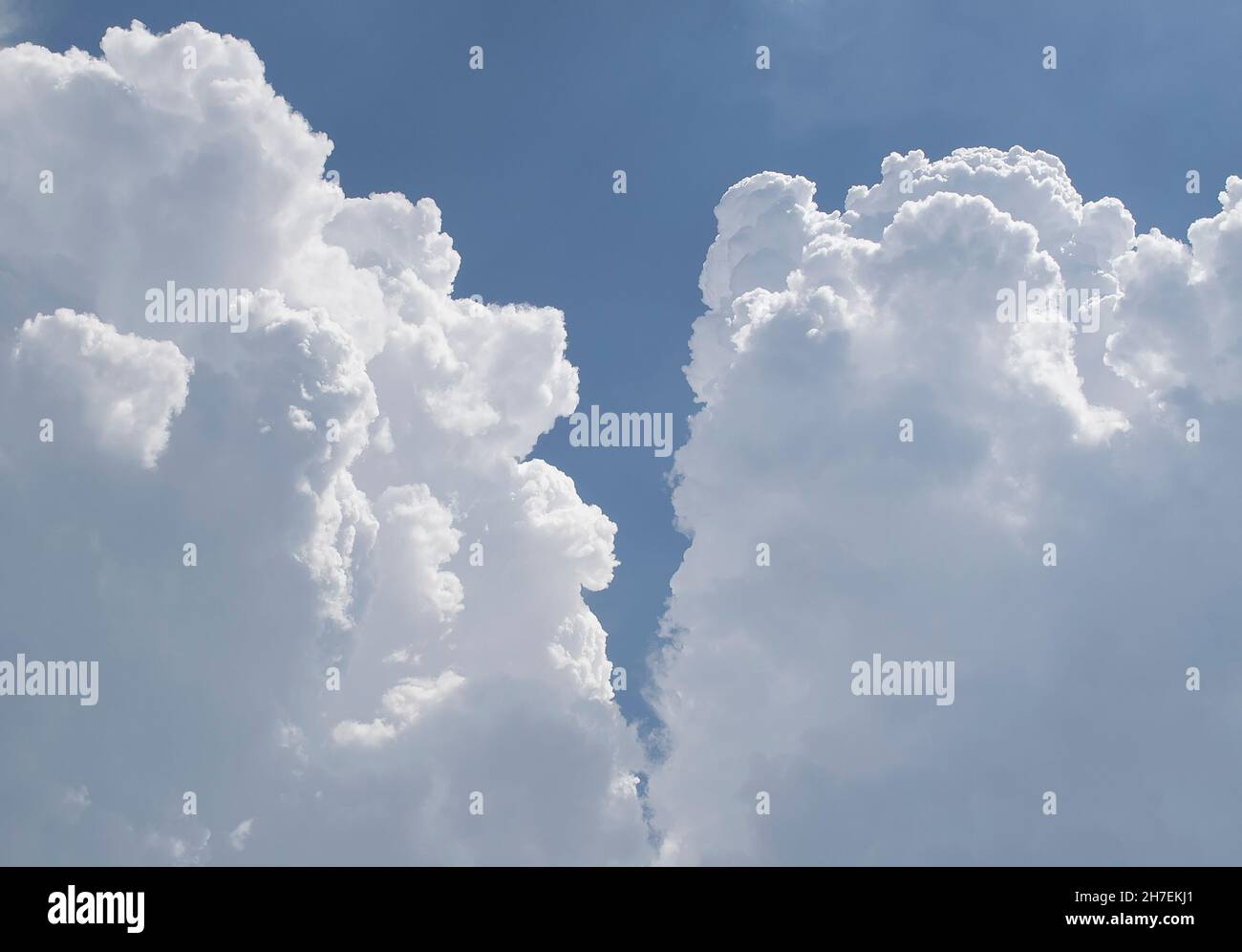 Blue summer sky with fluffy white clouds Stock Photo - Alamy