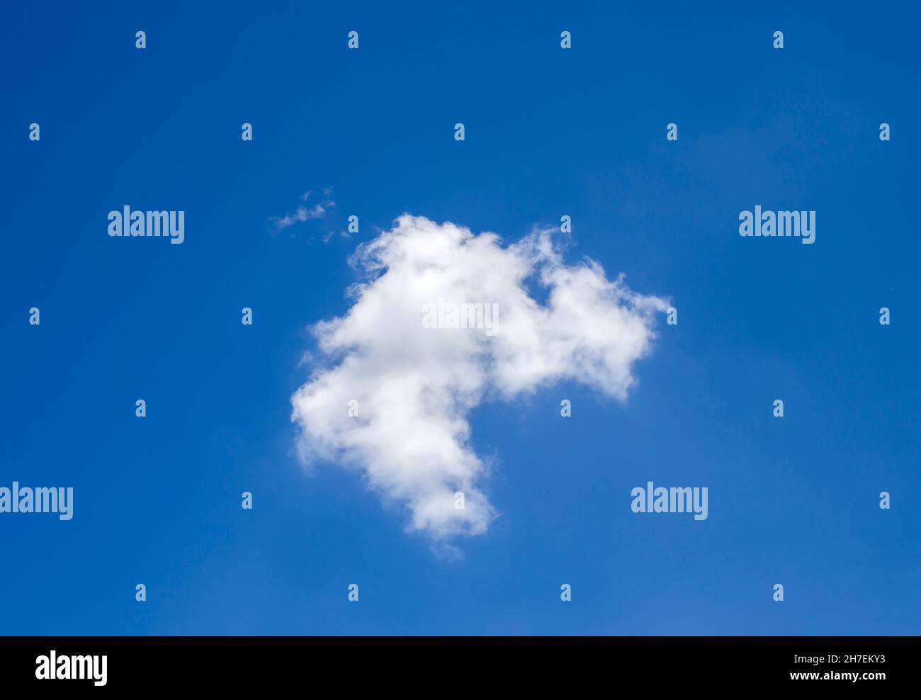 Single white cloud flying alone in the deep blue summer sky Stock Photo ...