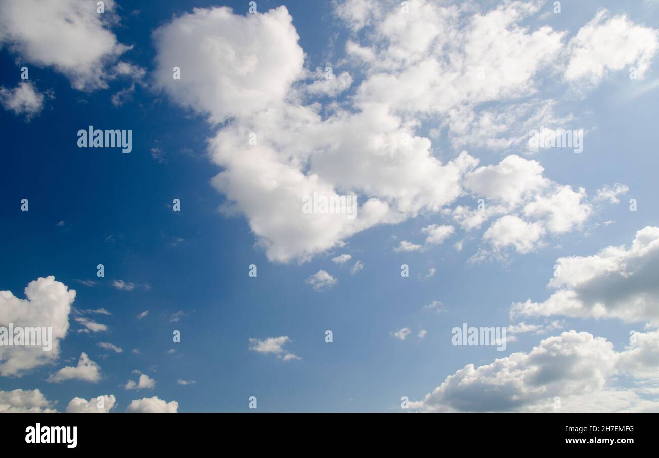 Blue summer sky with white clouds, natural background Stock Photo - Alamy