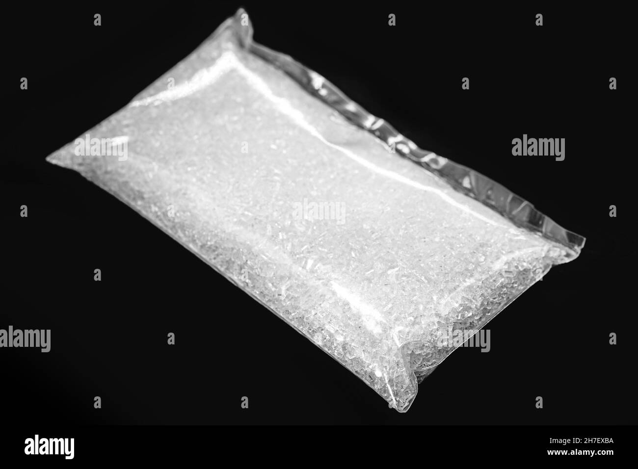 Sodium Thiosulfate on isolated black background. Solid and crystalline chemical product used in the pharmaceutical industry and in the analysis of dri Stock Photo