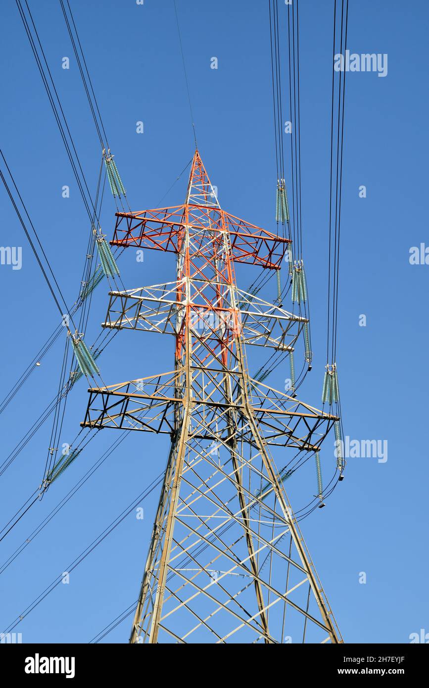 Red and white painted transmission tower Stock Photo