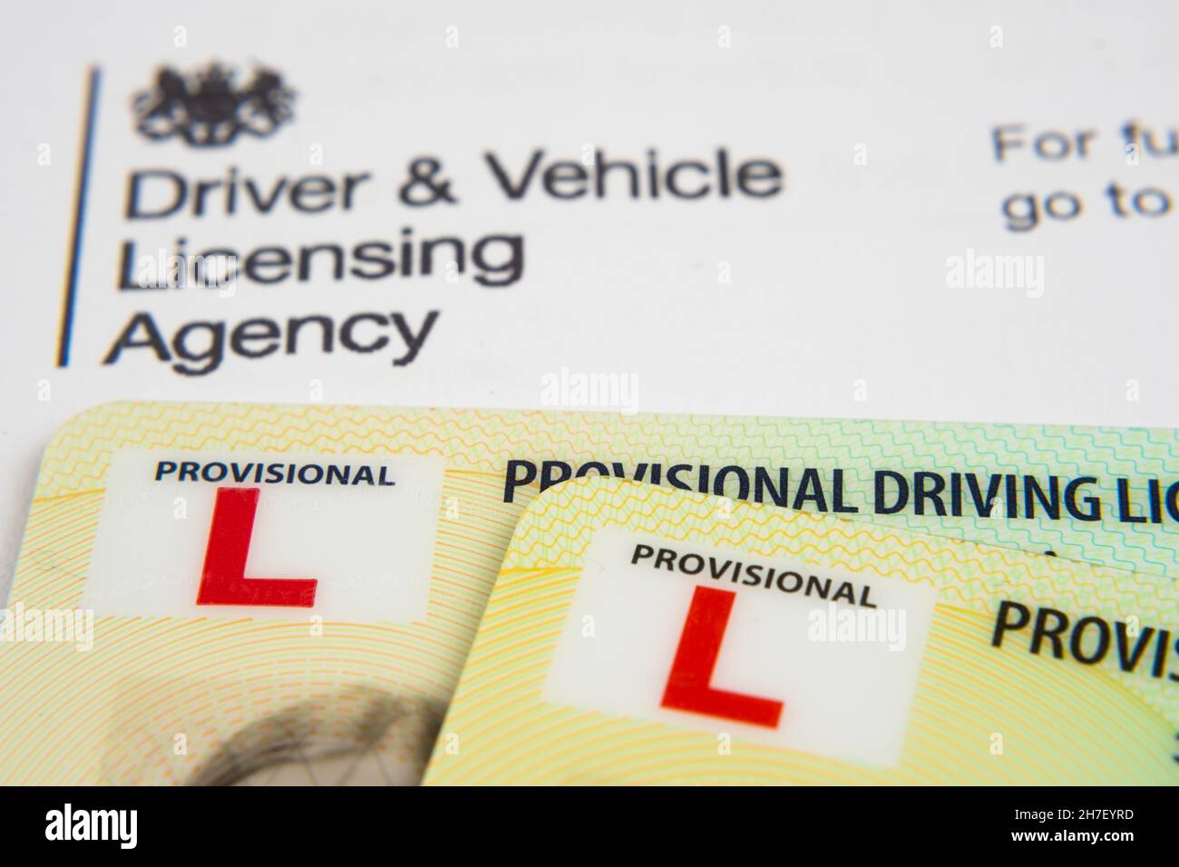 UK Provisional Driving Licence cards placed on top of the genuine letter form Driver and Vehicle Licensing Agency. Stafford, United Kingdom, November Stock Photo