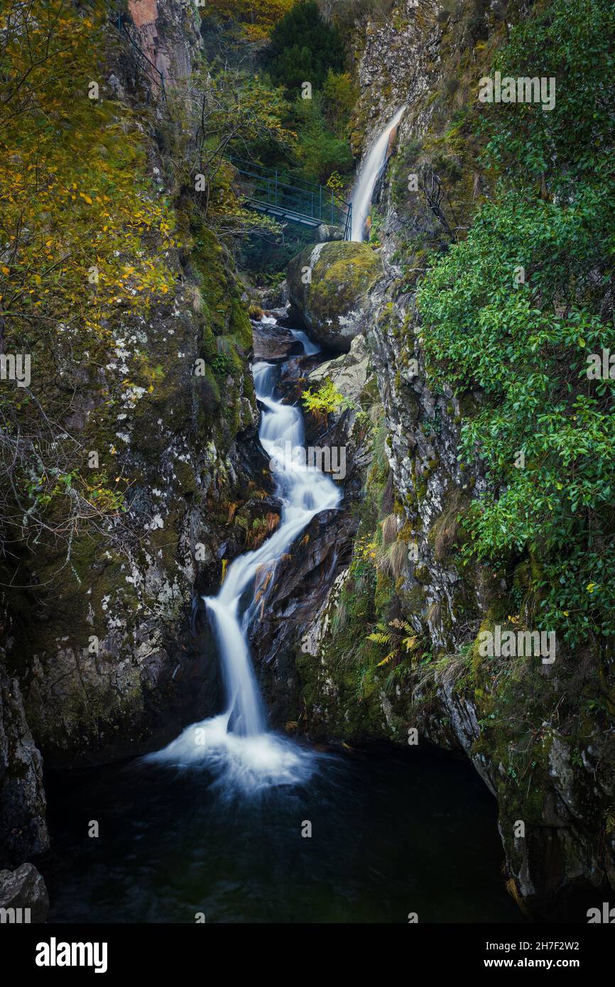 Waterfall in Manteigas Town, Serra da Estrela or Mountain of Star in Portugal called Poco do Inferno or Hell Pit Stock Photo