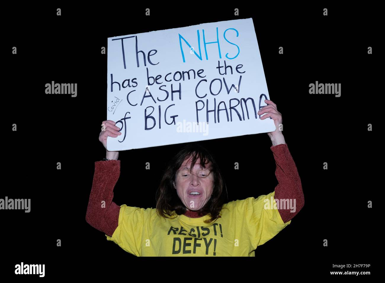 London, UK, 22nd Nov, 2021. A anti-vaccine counter-protester holds up a banner at a Unite Union protest rally in Whitehall, held ahead of the Health and Care Bill's third reading and vote in parliament. The union which represents 100,000 health care workers rejects the bill as they argue it will allow privatisation, lead to cuts, and will not allow proper scrutiny of contracts awarded. Credit: Eleventh Hour Photography/Alamy Live News Stock Photo