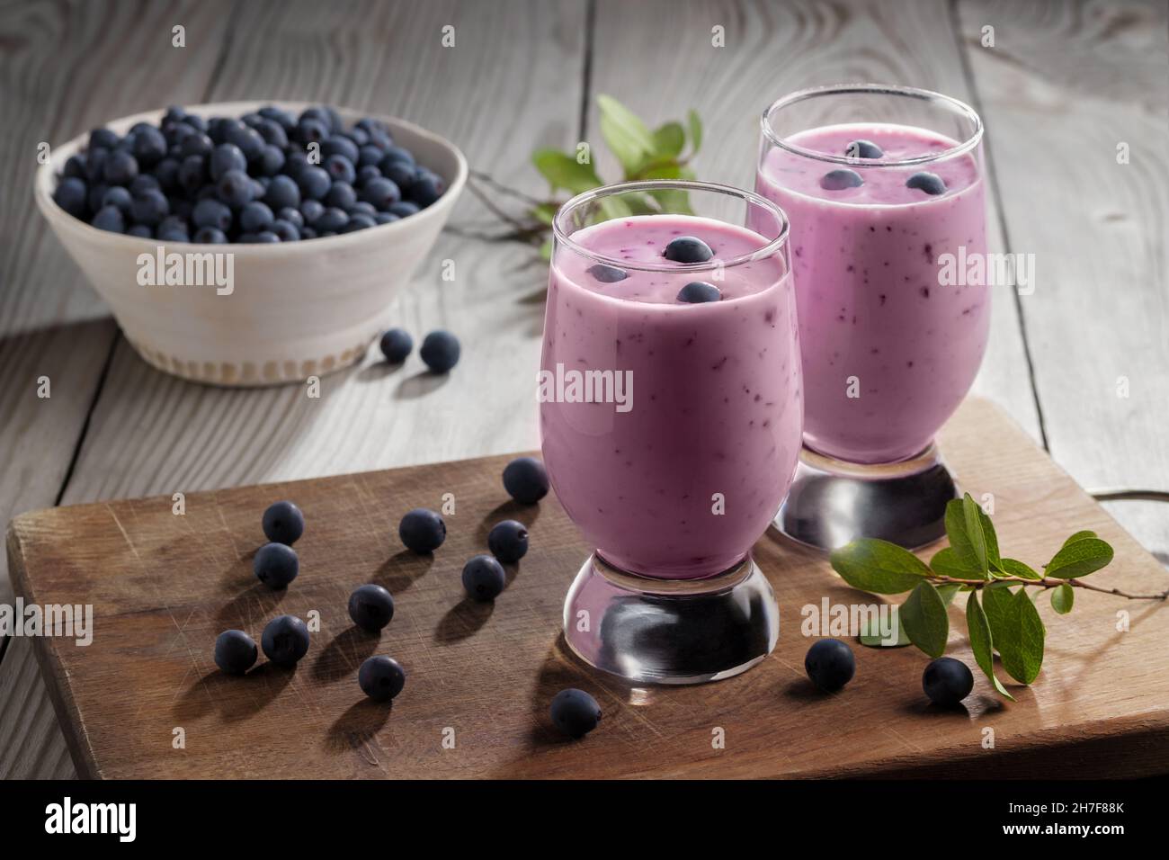 Homemade blueberry yogurt smoothie. Protein shake with berries. Stock Photo