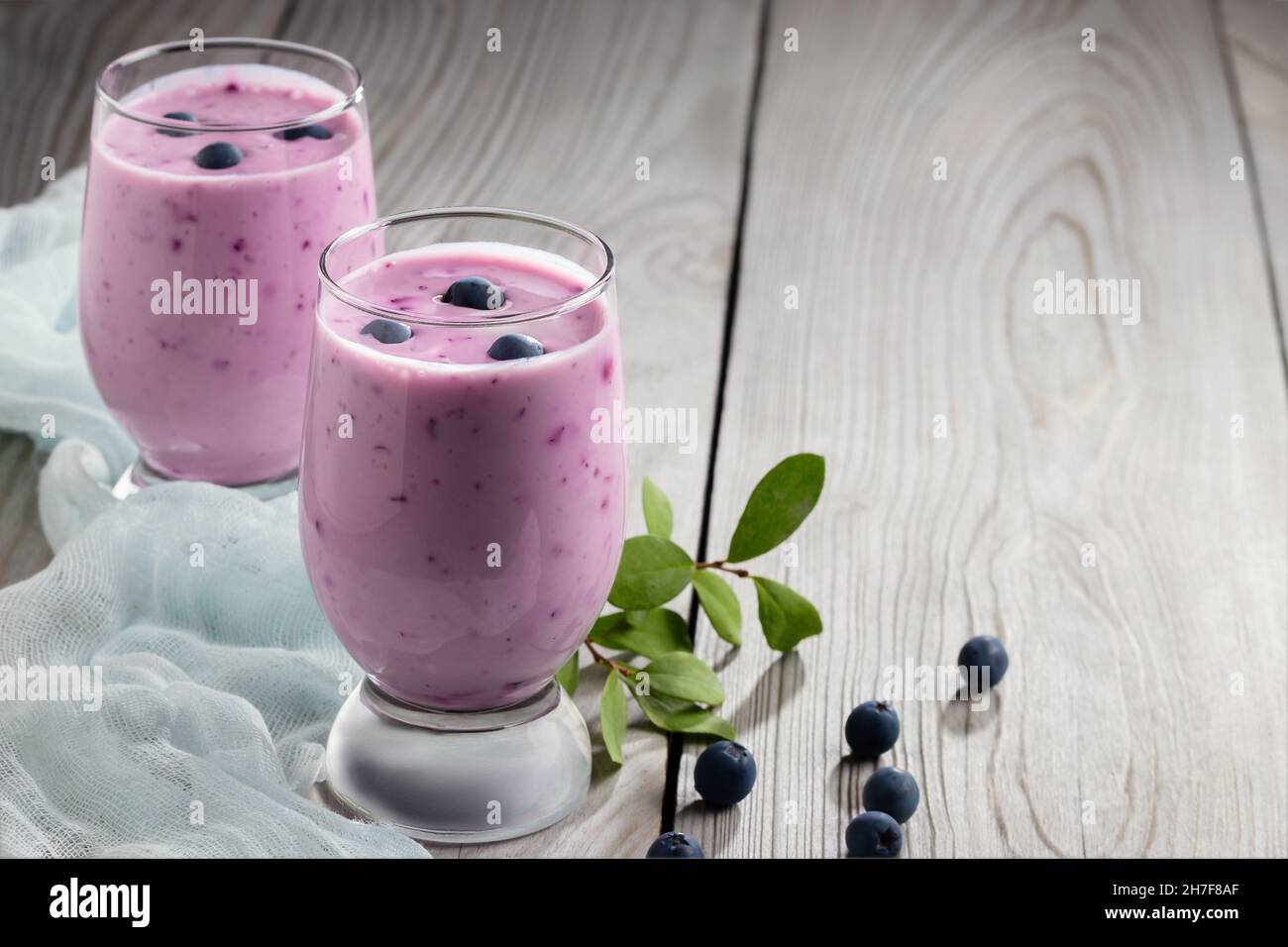 Homemade blueberry yogurt smoothie. Protein shake with berries. Stock Photo